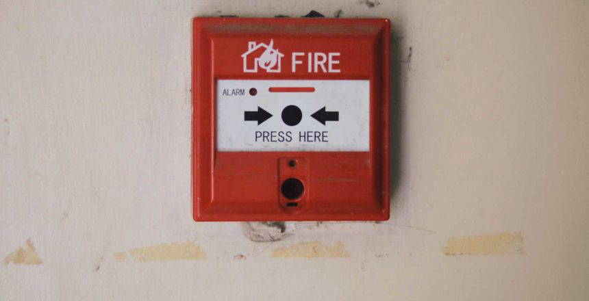 fire alarm attached to wall